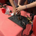 A student in attendance learns how to stud weld with assistance from Michael Stephan.