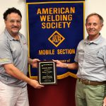 Michael Stephan accepts a plaque of appreciation from Mike Barnett, AWS Mobile Section 2nd Vice Chair.